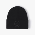 Classic black knitted beanie hat with stylish smiley face embroidery detail for winter - One Size / Black
