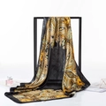 Bohemian black silk square scarf with green paisley print on a black display stand - 90x90cm / Paisley Black
