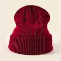 Detail shot of the thick ribbed knit texture and red black striped pattern on the winter hat - Black Red