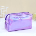 Sleek holographic purple makeup bag with shiny metallic finish on a white surface - Purple