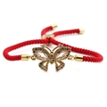 Adjustable red braided rope bracelet with a gold butterfly pendant set with colorful zircons - Butterfly Pendant / Red Rope
