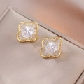 Floral stud earrings in gold with oval zircon center and micro-paved crystal petals - Gorgeous Oval Surrounded Flower Style (E1118)