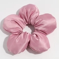 Macro detail of a large fabric flower scrunchie in dusty rose with a silky satin texture - Peach Red (Approx. 18cm)