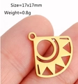 Golden stainless steel lotus flower pendant 17x17mm shown on finger for scale - DY952 / Gold