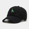 Close-up of green frog embroidery detail on a black cotton baseball cap surface - Black