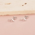 Detailed macro shot of mountain peak stud earrings in silver on pink fabric - Steel Color Mountain Peak (MP402)