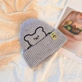 Grey knitted beanie featuring cartoon bear embroidery and yellow woven tag label - One Size / Gray