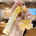 Yellow starfish floating keychain with acrylic flower pendant and Happy Moments strap - Yellow