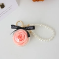 Pink preserved rose in acrylic ball keychain with white pearls and black ribbon - Water Pink