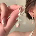 Detailed close-up of pink gradient acrylic flower earrings with faux pearls and green leaves - 15# Silver Earring Post-Silver-Pink