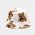 Close-up of soft white faux fur bucket hat featuring a cute brown bear pattern detail - M (56-58cm) / White