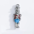 Macro detail of nutcracker soldier pendant with red and blue enamel for DIY jewelry - Nutcracker Soldier