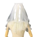 White bridal veil with pearl embellishments and a satin ribbon bow on a wooden mannequin - 2 Layers 40-60cm / Pure White with Pearls