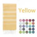 Yellow Turkish beach towel with white stripes and fringe, featuring 25 color swatches - Turmeric