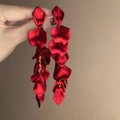 Elegant deep red petal tassel earrings with gold link chains shown in hand - 22# Steel Pin - Red