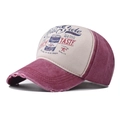 Detail of vintage washed cotton baseball cap with retro lettering and distressed brim edges - Cola Wine Red / Adjustable