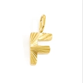 Macro shot of gold letter F pendant with sunburst texture and polished metal bail - Letter F - Gold