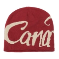 Detail of red knit beanie featuring white Canada jacquard lettering and textured fabric - M (56-58cm) / Burgundy