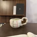 Handcrafted wavy ceramic mug with pink hearts and unique curly handle on a wooden desk - Cute Ball Hearts Single Mug / Single Cup