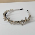 Macro detail of silver crystal beads on golden metal base of the luxury headband - Style SJ004 Large Crystal / Silver Gray