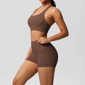 Detail view of seamless high-waist yoga shorts and racerback sports bra in chocolate brown - S / Chestnut Brown