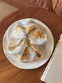 Artistic marble print scrunchie in yellow and blue chiffon on a white ceramic plate - Hair Tie