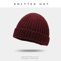 Classic knitted beanie hat in deep wine red color with warm ribbed wool texture - One Size / Burgundy