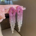 Close-up of pink gradient rhinestone tassel earrings worn by a model in elegant style - 3# Silver Needle / Gradient Rose Red Tassel