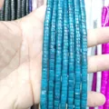 Macro shot of 3x6mm cylindrical blue tiger eye stone beads for jewelry making - Amazonite