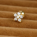 Macro shot of gold flower earring with clear cubic zirconia in a velvet box - Gold 0.8mm