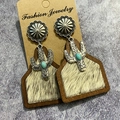 Detail of western earrings with cactus metal charm and faux cowhide fur texture - Brown Faux Fur