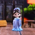 Macro shot of a cute chibi ancient Chinese figure in purple attire with butterfly accents - Lady Huarui
