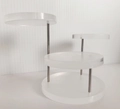 Detail of three-tier white acrylic jewelry display stand with silver metal support rods - 3-Round Display Stand / Clear