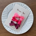 Three-piece set of pink and purple gradient bow hair clips on a white display card - Burgundy Series