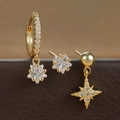 Macro detail of gold star earrings set with micro-inlaid cubic zirconia on leather - Style 1 (E1603-1) / Gold