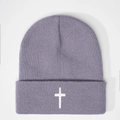 Detail of lavender knit beanie featuring a white embroidered cross on the cuff - Light Silver Grey
