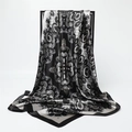 Macro detail of cashew print satin scarf with paisley patterns on luxury fabric texture - Black Silver Symmetrical Paisley (FT266-3)