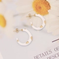 Elegant gold-plated enamel hoop earrings with white drip oil finish on daisy background - White