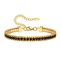 Bracciale in acciaio dorato con zirconi neri e dettaglio dell'incisione K18 - Oro Nero