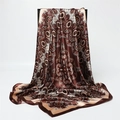Brown paisley satin scarf with elegant silk sheen draped on a display stand - Brown Gold Retro Paisley (FT266-2)