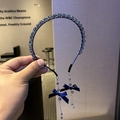Navy blue crystal headband featuring elegant side bows and long beaded tassel fringe - Blue