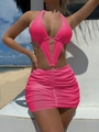 Detail view of pink cutout swimsuit featuring a golden metal ring and pleated mini skirt - S / Rose Red