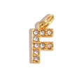 Macro shot of gold-plated letter F pendant featuring sparkling white zircon inlay - Letter F / Gold