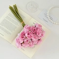 Pink artificial tea rose bouquet on an open book for elegant wedding or home decor - Rose Red