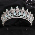 Close-up of a silver baroque crown featuring light blue teardrop gems and rhinestones - Silver White Rhinestone + Green Opal