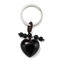 Macro view of polished heart-shaped black stone keychain with woven beads detail - Obsidian