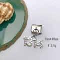 Detailed macro of silver number 1314 charm with zircon stones for DIY bracelets - Model 134-1314 Number