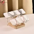 Double-tier solid wood jewelry stand with white faux leather cushions for watch display - 2-Tier Solid Wood Bracelet Stand-White PU