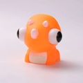 Orange triceratops squeeze toy with pop-out eyes for stress relief and fun play - Pop Out Eyes Triceratops