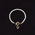 Elegant white oval pearl bracelet featuring a gold OT toggle clasp and rhinestone letter U charm - Gold Letter U (SL2013)